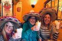 Bucket list goal: Mum Kate Hannant (centre) wanted to go to Mexico.That wasn't possible so sisters Amanda Churcher (left) and Lisa Taylor took her for pina coladas at Pedros restaurant in Norwich  Picture: Contributed