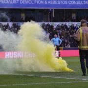 A yellow smoke bomb was thrown on to the pitch at The Den as Norwich City fans celebrated Gabriel Sara's goal during the 3-2 win - Picture: Paul Chesterton/Focus Images