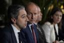 Irish premier Simon Harris and deputy premier Micheal Martin have talked about immigration challenges (Niall Carson/PA)
