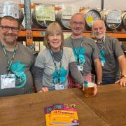 Volunteers behind the bar at the Norwich Beer Festival 2023  at The Halls
