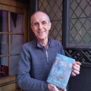 Paul Dickson with the C J Sansom’s book Tombland which inspired a walk telling the story of Kett’s Rebellion…and more