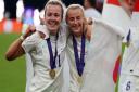 England's Lauren Hemp and Chloe Kelly following victory over Germany in the UEFA Women's Euro 2022 final at Wembley Stadium