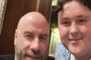 Jamie Salter with film star John Travolta, who dined at the Romany Rye, the Wetherspoon in Dereham, Norfolk.
