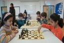 Photo 002 - Young chess players competing, left to right: Namira Ahmed (NJCC), Ruthven Ridley (Broadland), Kacper Golan (NJCC), Rafe Ridley (Broadland), Yaseen Mohammed (NJCC) & Sharvari Saharkar (NJCC).