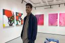 Artist Anmar Mirza at his solo show 'Life is a mess' at Moosey Art in Norwich.