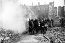 IMAGES OF NORWICH BOOKChapter The Second World War, Page 45.MEN OF THE NFS IN THE AREA OF RAMPANT HORSE STREET.DATE 30TH APRIL 1942PLATE P0874firemen tackle a blaze during the blitz in 1942