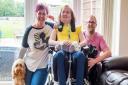 Maisie Lossau with her parents and the family dog. Picture: The Brain Tumour Charity