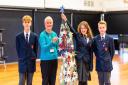 Students at Smithdon High School with Julie Bowyer, pastoral manager for Year 7, and the tree.