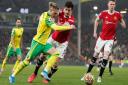 Przemyslaw Placheta beats Manchester United defender Harry Maguire to force a chance for Norwich City