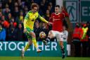 Josh Sargent and Diogo Dalot battle it out during the Premier League game between Norwich City and Manchester United.