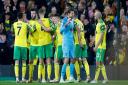 The Norwich players celebrate victory at the end of the Premier League match at Carrow Road