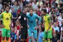 Tim Krul gets an explanation from Michael Oliver following Arsenal's match-winning goal in Norwich City's 1-0 Premier League defeat
