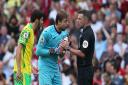Tim Krul leads the Norwich City protests following Arsenal's winner