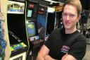 Owner Glen McDonald with the collection of arcade machines at Retro Replay in Norwich's Castle MallPicture: Neil Perry