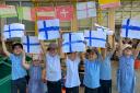 Reception children at Sprowston Infant School in Norwich holding up Finnish flags in support of Norwich City star Teemu Pukki who is playing against Russia for Euro 2020.
