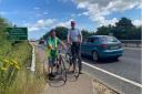 Derek Williams (left) and Peter Silburn from Norwich Cycling Campaign on the narrow shared use bike and pedestrian path by the side of the A47 over the River Yare, on the edge of Norwich