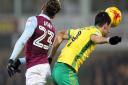Nelson Oliveira and Villa's Jordan Amavi clash during the game at Carrow Road in December. Picture: Paul Chesterton