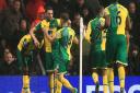 Norwich Citys Alex Tettey, left, celebrates with his team-mates after scoring against Manchester United at Old Trafford in December. Picture: Nigel French/PA