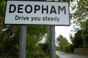 The village signs for Deopham in Norfolk take on the local dialect. Photo: Bill Smith