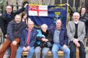 Ray Self's family gather around his memorial bench outside St Peter Mancroft church in Norwich. Photo: Bill Smith