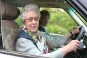 The Queen at the wheel having stopped to talk to the Sadd family during a holiday outing at Balmoral