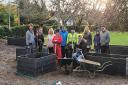 Ruth Burrows (in the red coat) with volunteers next to the new community garden at Sprowston Methodist Church