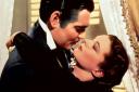 In this image released by Turner Classic Movies, Clark Gable, left, appears in character as Rhett Butler and Vivien Leigh as Scarlett O'Hara, in the film 