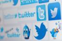 File photo dated 10/12/13 of twitter icons as Tweets from accounts that you do not follow will now appear in your Twitter timeline, the social network has confirmed. PRESS ASSOCIATION Photo. Issue date: Wednesday August 20, 2014. The new feature has been 