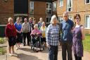 City councillors, Ash Haynes,  right, and Jo Henderson, front 3rd right, with resident Sidney Copland, front 2nd right, and other residents of Lakenfields sheltered housing, which the City Council want to demolish. Picture: Denise Bradley