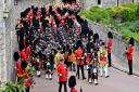 Musicians from the Scottish and Irish Regiments, the Brigade of Gurkhas, the Royal Air Force and The Band of the Grenadier Guards arriving for the Committal Service of Queen Elizabeth II at St George's Chapel, Windsor Castle, on September 19