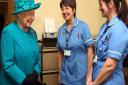 Queen Elizabeth II meets nurses Sarah Wallis and Daniela Reynolds (right) during a visit to The Norfolk Hospice at Hillington, near King's Lynn. PRESS ASSOCIATION Photo. Picture date: Thursday February 4, 2016.  The Queen met patients, trustees, volunteer