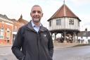 Kevin Hurn, Wymondham town and district councillor, in Wymomdham's Market Place and in front of the HSBC bank which is closing in August 2023