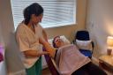 Emily Egle receives manual lymphatic drainage from therapist Lucy Grubb