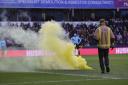 A yellow smoke bomb was thrown on to the pitch at The Den as Norwich City fans celebrated Gabriel Sara's goal during the 3-2 win - Picture: Paul Chesterton/Focus Images