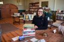 Lucie Riches at the headmaster's desk in the Old School Bookshop she has opened in Old Buckenham Picture: Denise Bradley