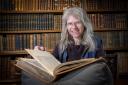 Norwich Cathedral's librarian, Gudrun Warren, is celebrating the 550th anniversary of the library's oldest book, Divine Institutes