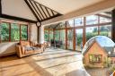 A four-bed detached house with views over Whitlingham Broad is on sale with Savills estate agent for £600,000