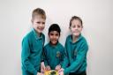 From left, Harry, Haider and Oliver, who ran 10 laps of their playing field on every school day of February at Hethersett Woodside Primary School