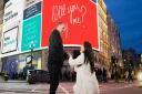 Polly Guy proposed to her partner, Tim Kemp, using the Piccadilly Circus billboards in London