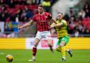 Ashley Barnes and Rob Dickie compete for the ball