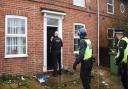 Police enter a property on the Aylsham Road in Norwich during an Operation Gravity drugs raid.