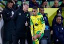 Norwich boss Dean Smith gives instructions to Max Aarons during defeat to Manchester City