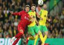 Billy Gilmour of Norwich and Alex Oxlade-Chamberlain of Liverpool in League Cup action at Carrow Road in September
