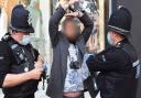 Protester is arrested by police during a demonstration in Norwich against coronavirus restrictions for which a woman was later fined £10,000.