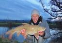 John Bailey, scruffy as a scarecrow, happy with his winter barbel