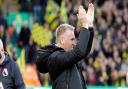 Dean Smith applauds the Carrow Road faithful ahead of his first game as head coach of Norwich City last month