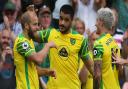 Teemu Pukki thanks Norwich City team-mate Mathias Normann, right, for the assist for his goal against Watford