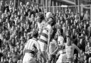An aerial battle at Loftus Road in April 1979, with Kevin Bond winning a header during a 0-0 draw, with Martin Peters watching on