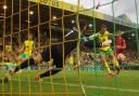Alisson foils Ben Gibson in Norwich City's 3-0 Premier League defeat to Liverpool