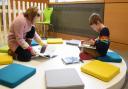 Youngsters enjoying books at the Norfolk and Norwich Millennium Library